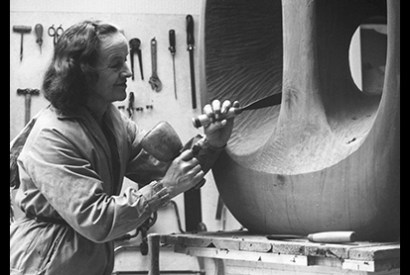 Barbara Hepworth in the Palais de la Danse studio, St Ives, at work on the wood carving ‘Hollow Form with White Interior’, 1963